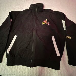 Nike Air Jordan track suit. Large. Jacket and pants. Black with colorful logos.